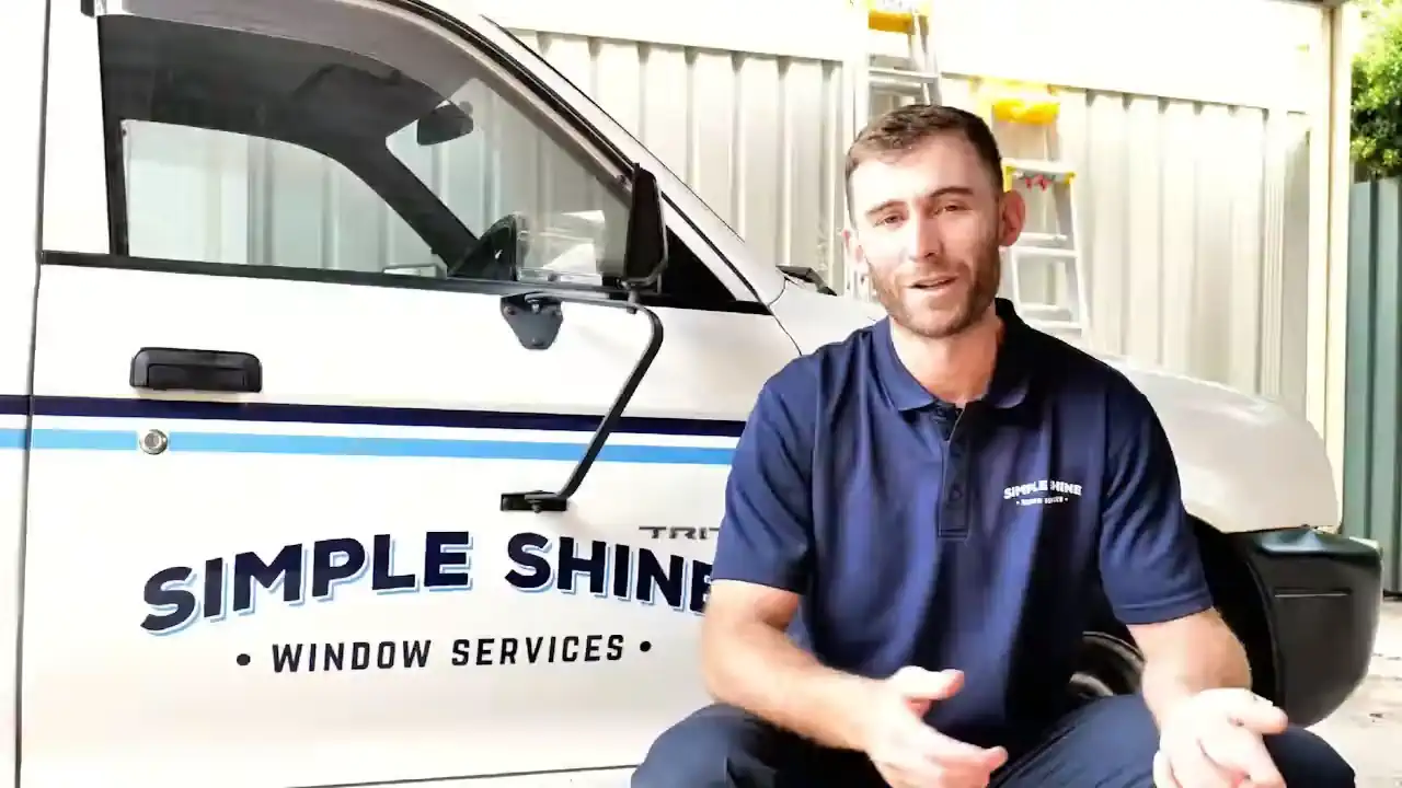 Simple Shine technician cleaning windows